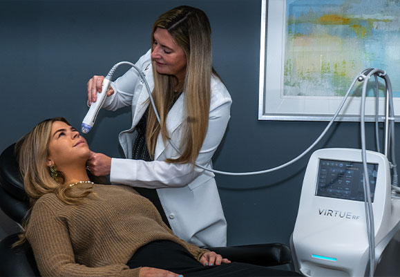 Woman receiving skin treatment with Virtue RF